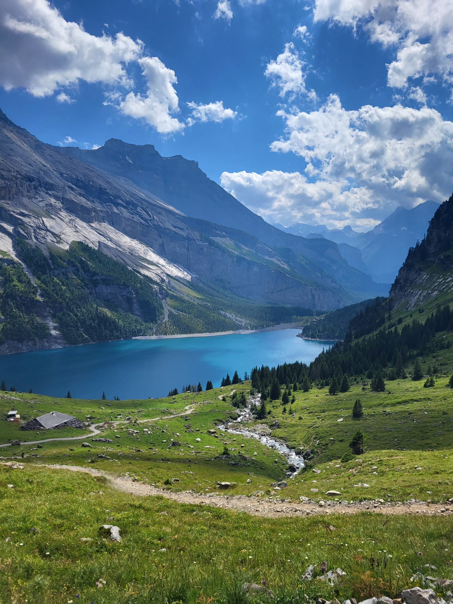 A breathtaking mountain view in Switzerland with towering peaks, rugged slopes, and a clear sky, capturing the majesty of nature.